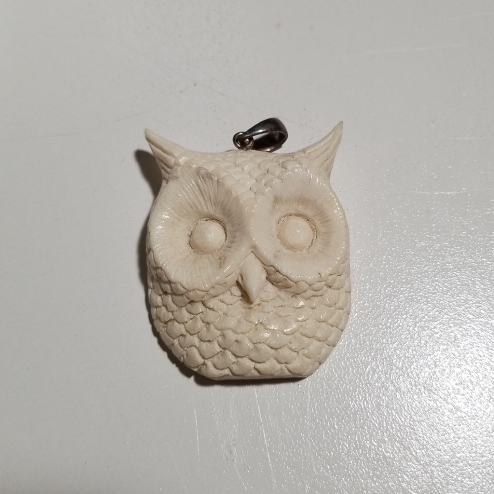 Owl pendant carved from deer antler